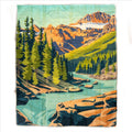 "The Montana Scene Wildwood Stream outdoor blanket laid flat — full view of illustrated turquoise mountain stream winding through pine forest with rocky peaks in warm golden light on white background"