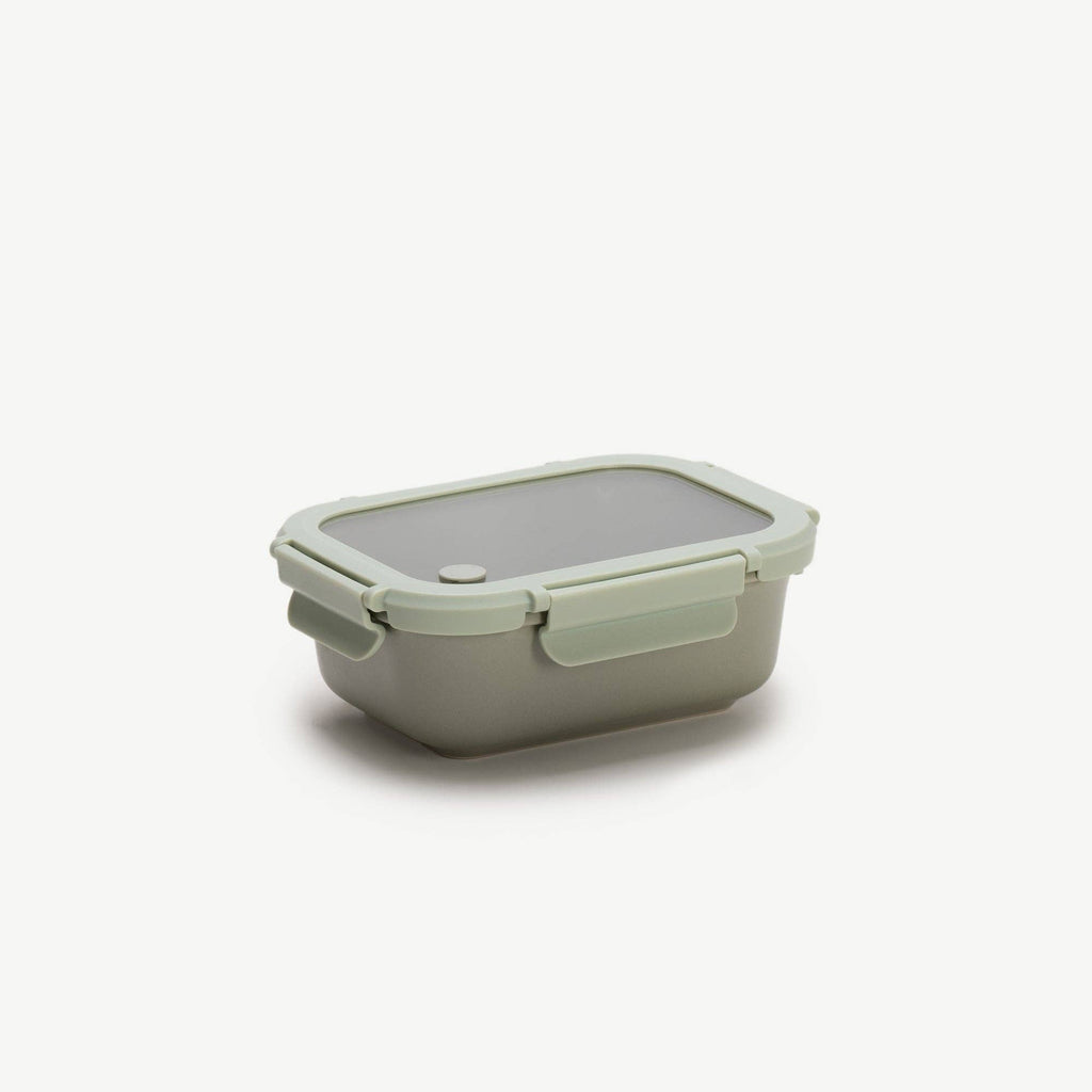 Green rectangular container with a lid on a white background
