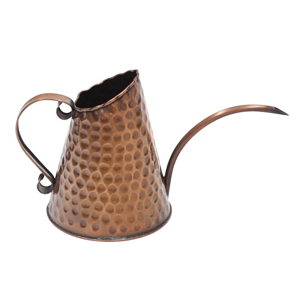Hammered copper watering can with long slender spout and scrolled handle shown in full profile against a white background