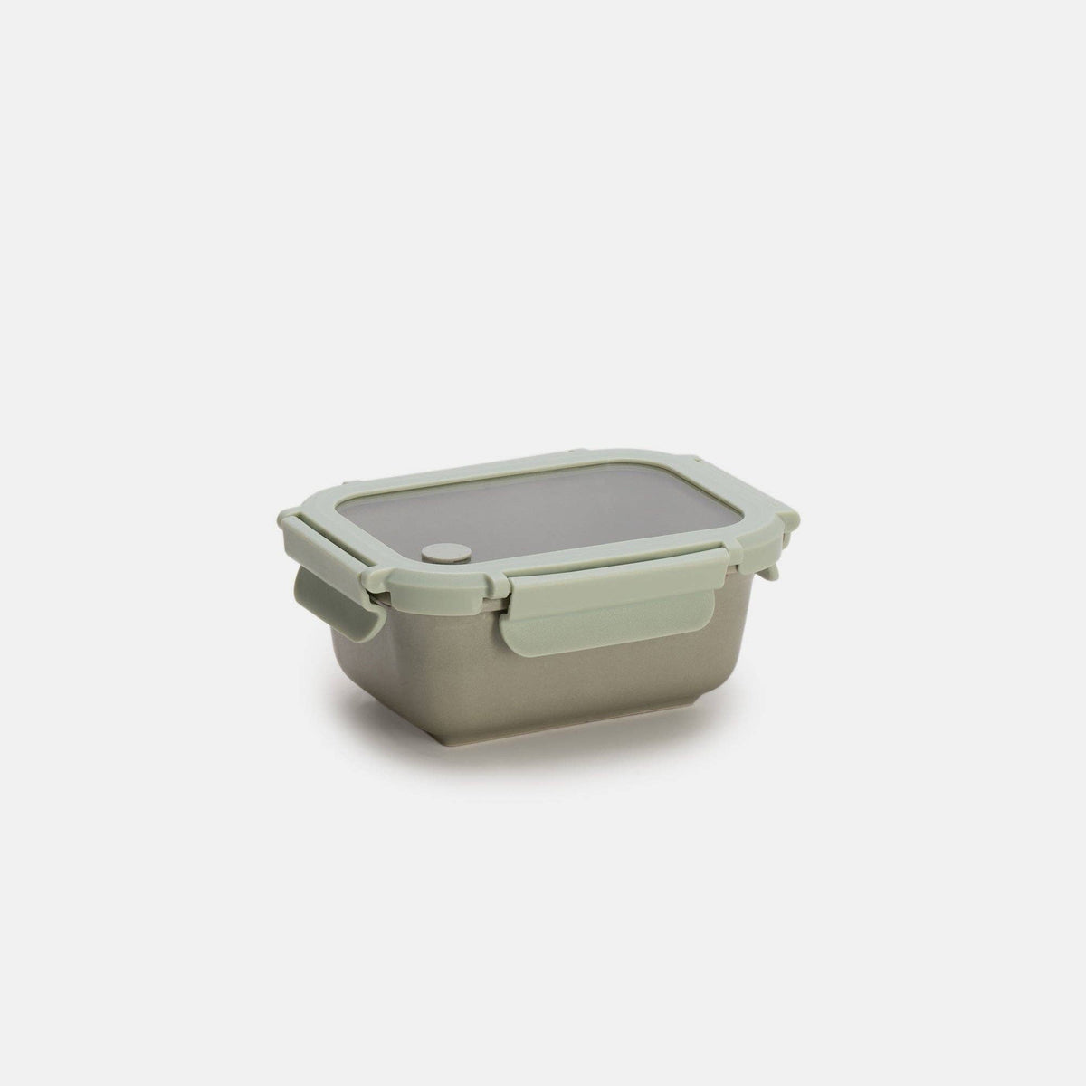 Green silicone food storage container on a white background