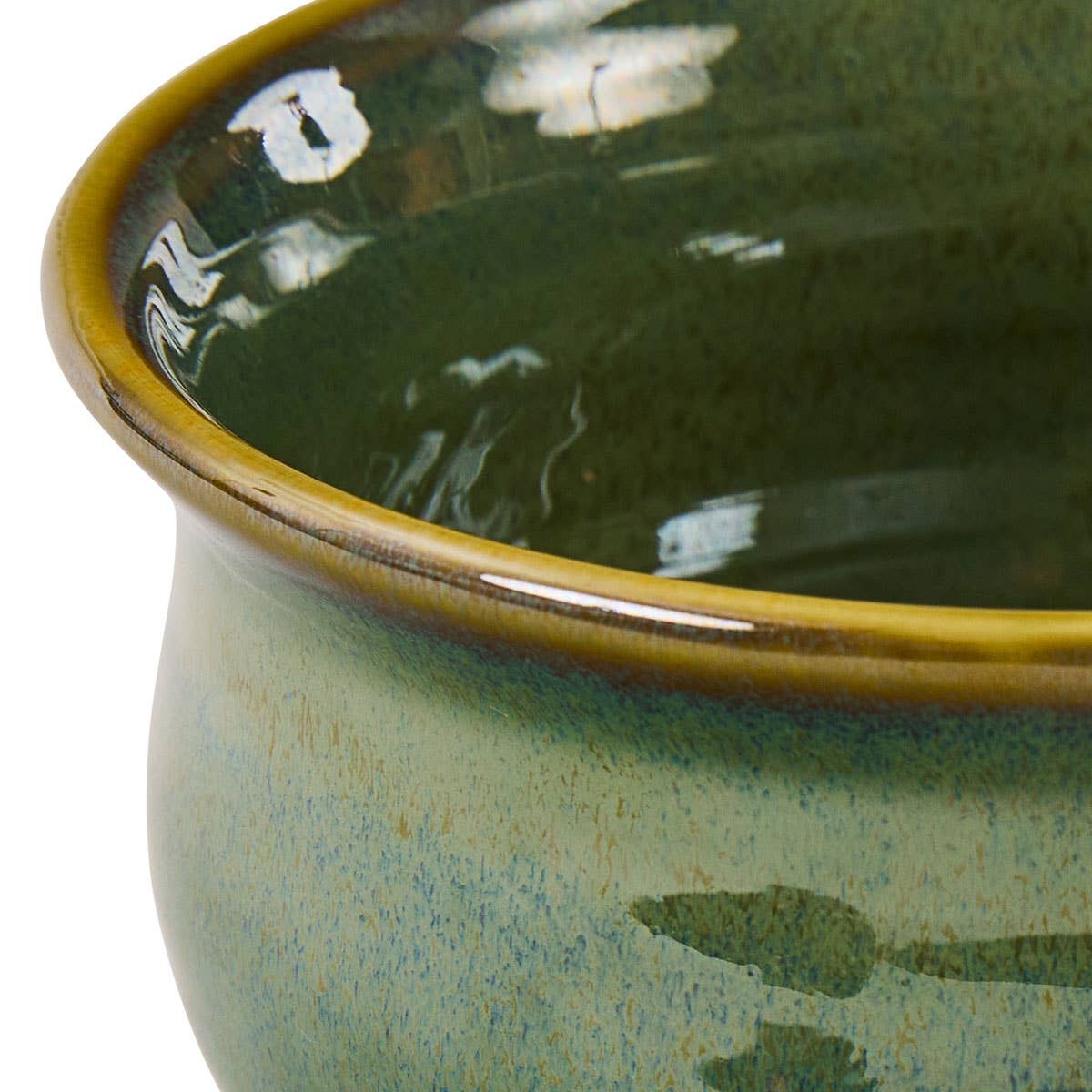 Close-up of Park Designs Sinclair Caprese cereal bowl showing sage green and amber reactive glaze with golden rim detail"