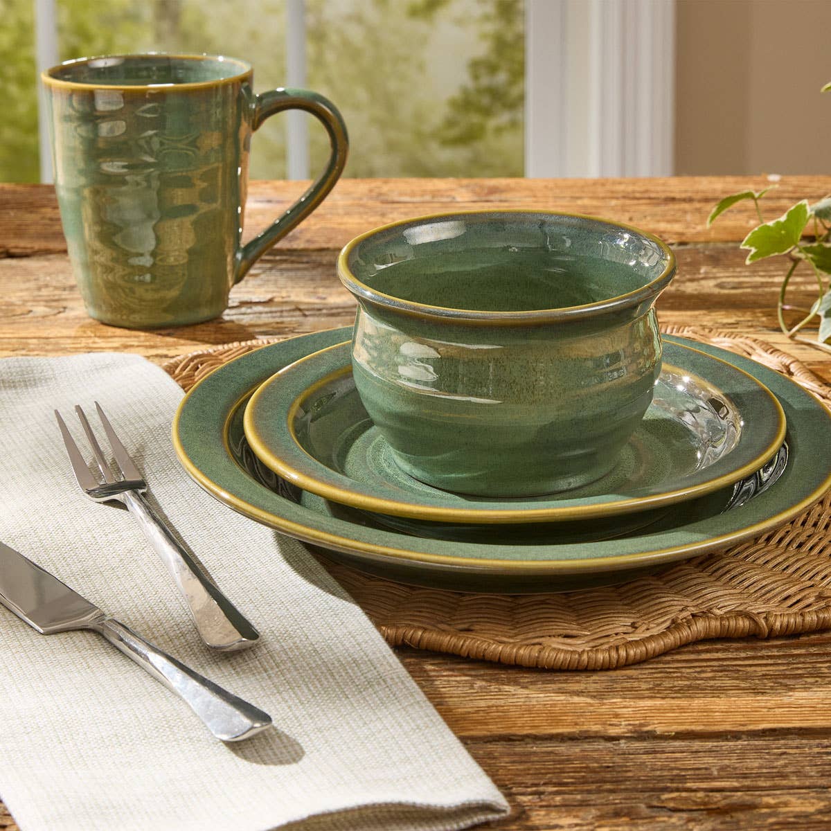 Park Designs Sinclair Caprese cereal bowl styled in a complete place setting on a farmhouse wood table with matching salad plate, dinner plate, mug, and woven placemat"