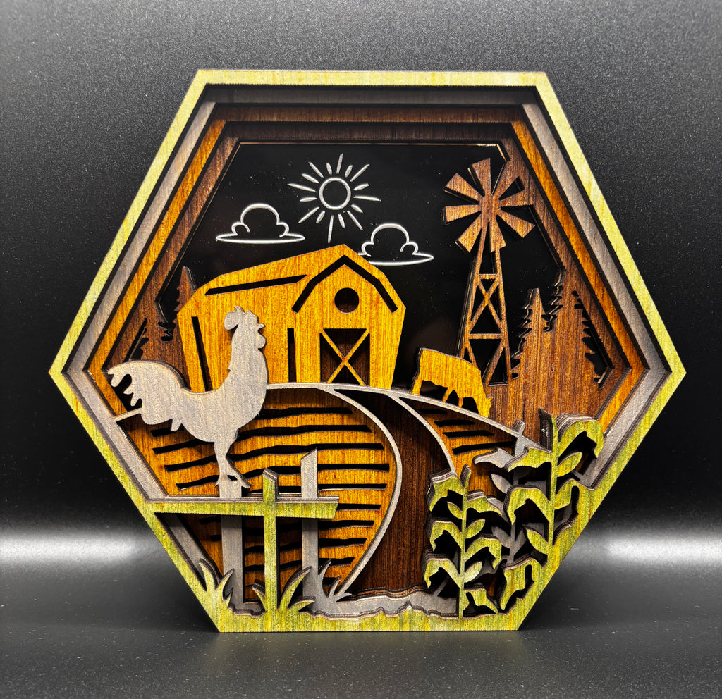 Hexagonal layered wood farm shelf sitter with a yellow barn, rooster, cow, windmill, corn stalks, and etched sun and clouds.