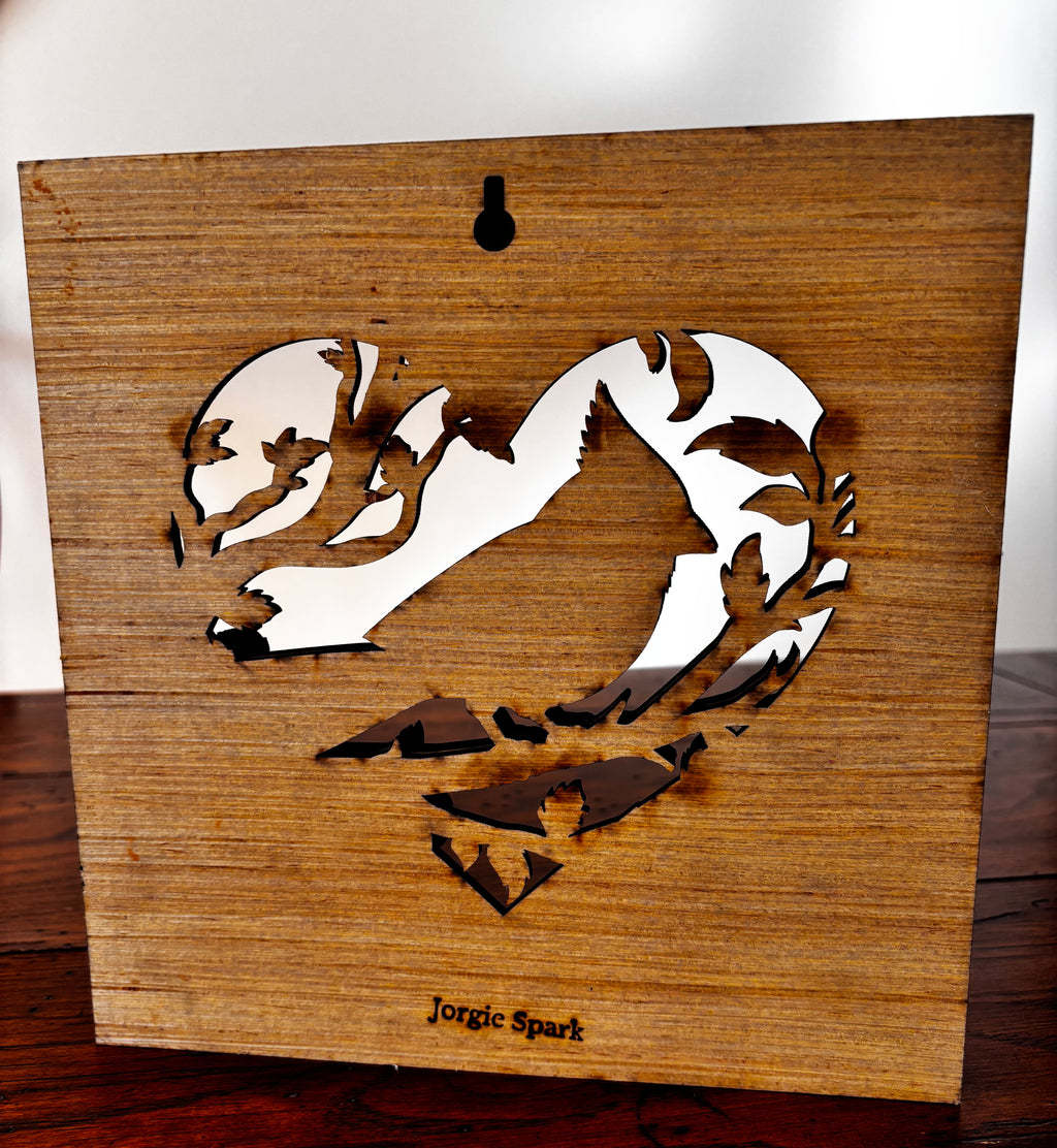 Back of the cardinal wood plaque showing the keyhole hanger, open heart design and Jorgie Spark maker’s mark.