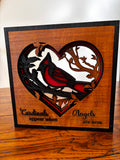 Layered wood cardinal heart plaque with red and black detailing and the message “Cardinals appear when Angels are near.”