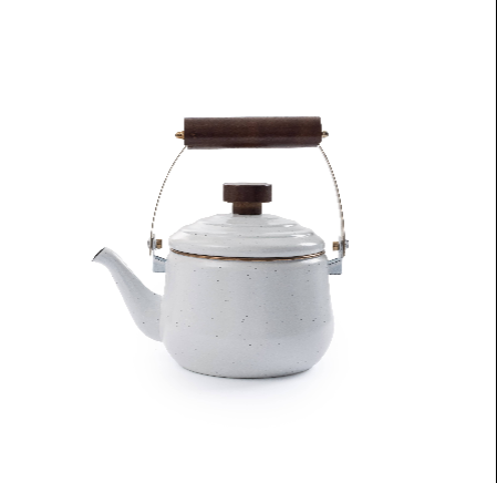 White enameled kettle with wooden handle and lid knob on a white background