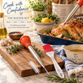 The Perfect Roast Kit displayed on a wood cutting board with a golden roasted chicken in a blue baking dish, featuring the HIC roasting baster, cleaning brush, needle, and Mrs. Anderson's red silicone pastry brush, with garlic, herbs, olive oil, and a "Better Meals Brighter Days" bowl. Text reads "Cook with Confidence — The Baster Set."