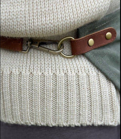 Close-up of Celtic Farm half apron real leather adjustable strap with brass clasp and riveted hardware detail