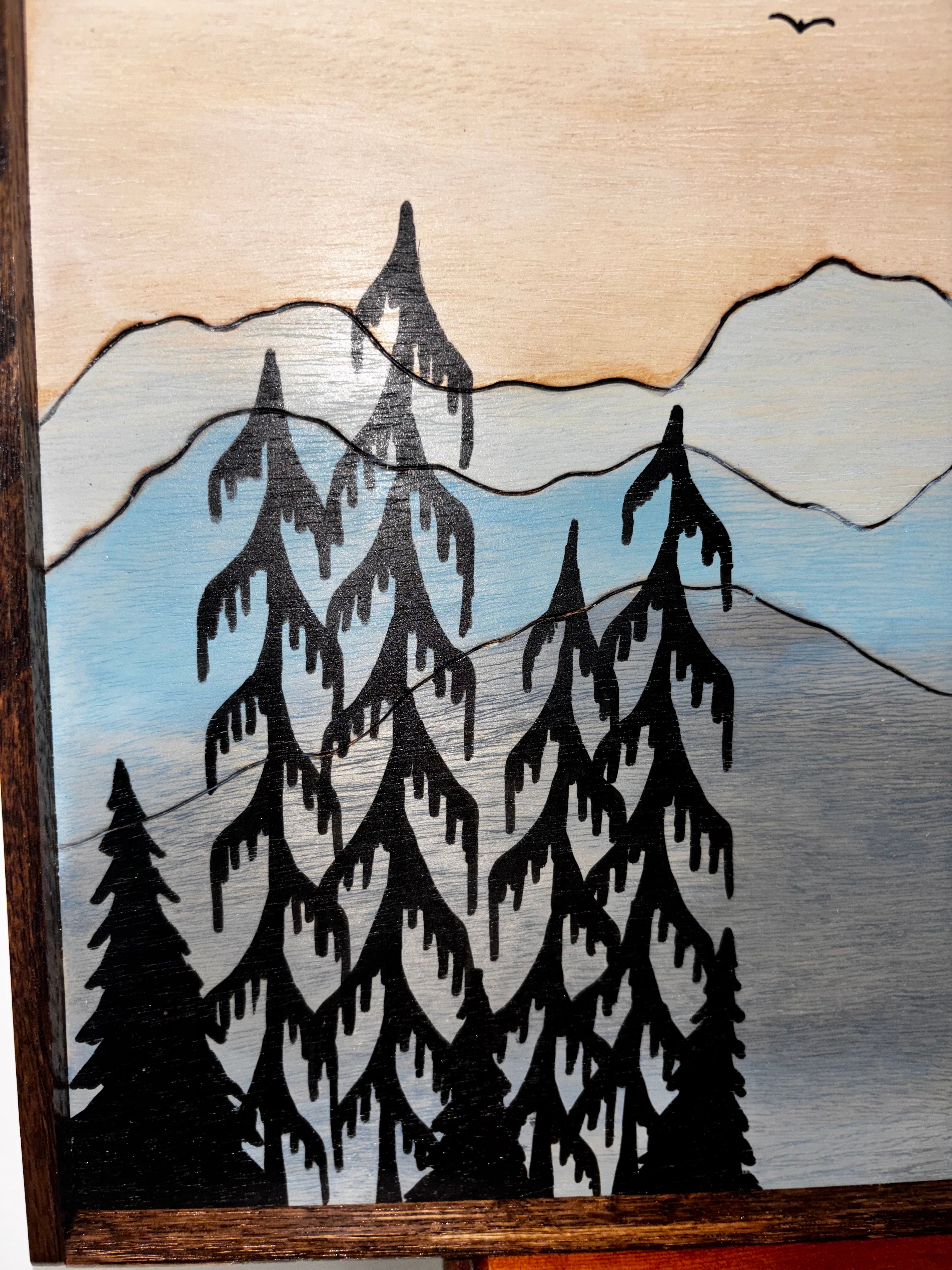 Close-up detail of bear family silhouette on wood burned and painted birch plywood, natural wood grain visible

