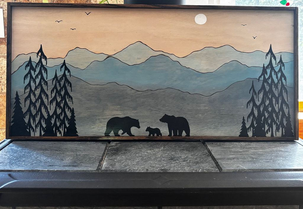 Bear family silhouette walking through a moonlit blue mountain landscape, framed mixed media wood art by Adirondack Art Co.