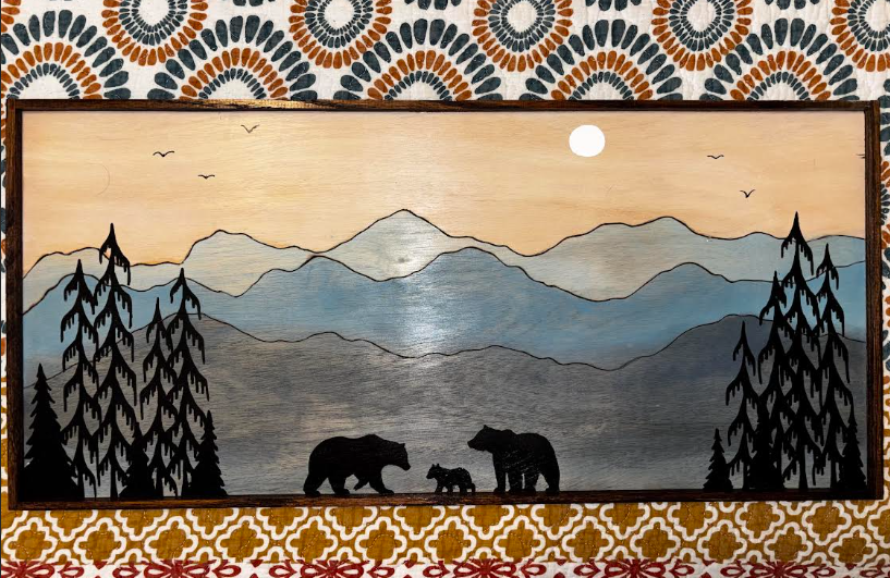 Full view of framed bear family wood art displayed on a wooden surface, pyrography and acrylic paint on birch plywood