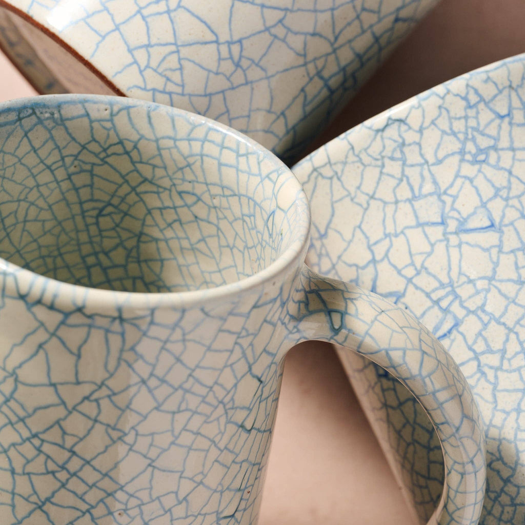 Top view of blue crackle ceramic mug and matching bowl showing glaze detail — part of the Indigo Night ramen collection"