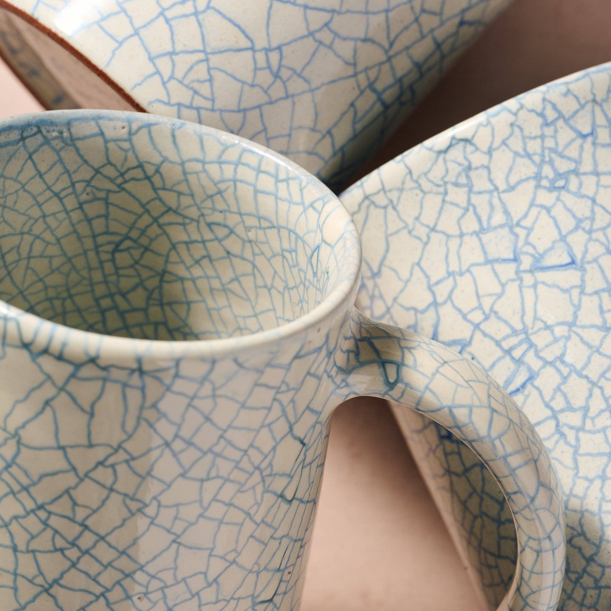 Top view of blue crackle ceramic mug and matching bowl showing glaze detail — part of the Indigo Night ramen collection"