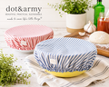 Brand lifestyle shot — Dot & Army reusable ticking stripe bowl covers in navy and red on bowls in a kitchen setting with fresh herbs, garlic, and pizza dough — Made in USA
