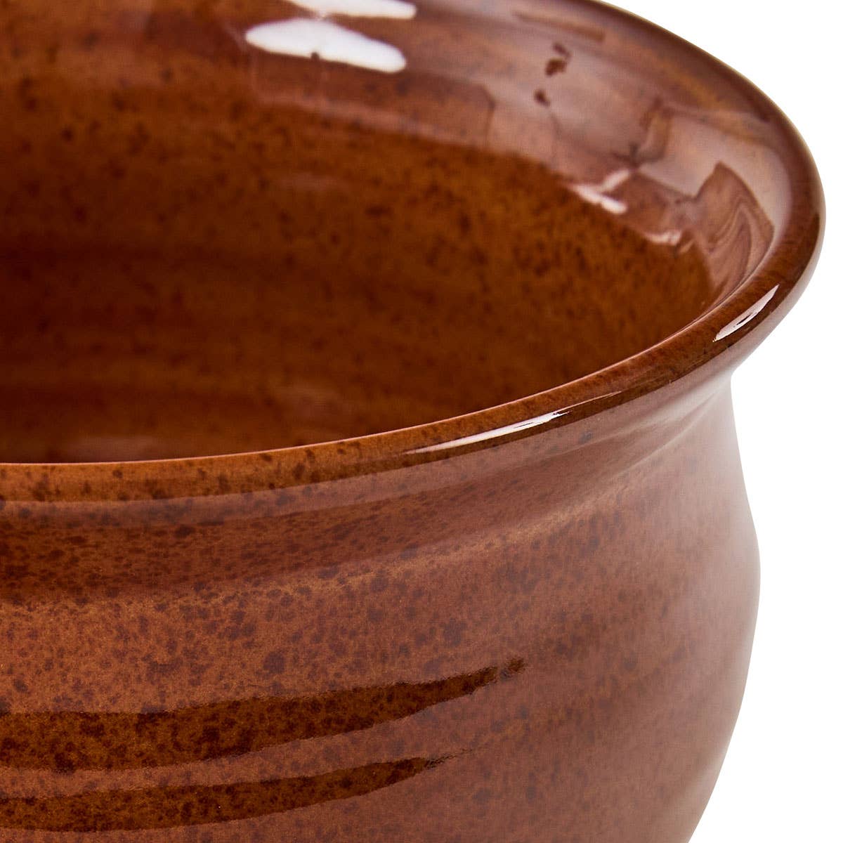 Close-up of Park Designs Sinclair Tomato Soup cereal bowl showing warm russet and amber reactive glaze with banded ridge detail and glossy finish"
