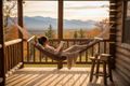 "Woman reading a book in a Magnolia Casual chocolate hammock on a log cabin porch with fall foliage and mountain views"