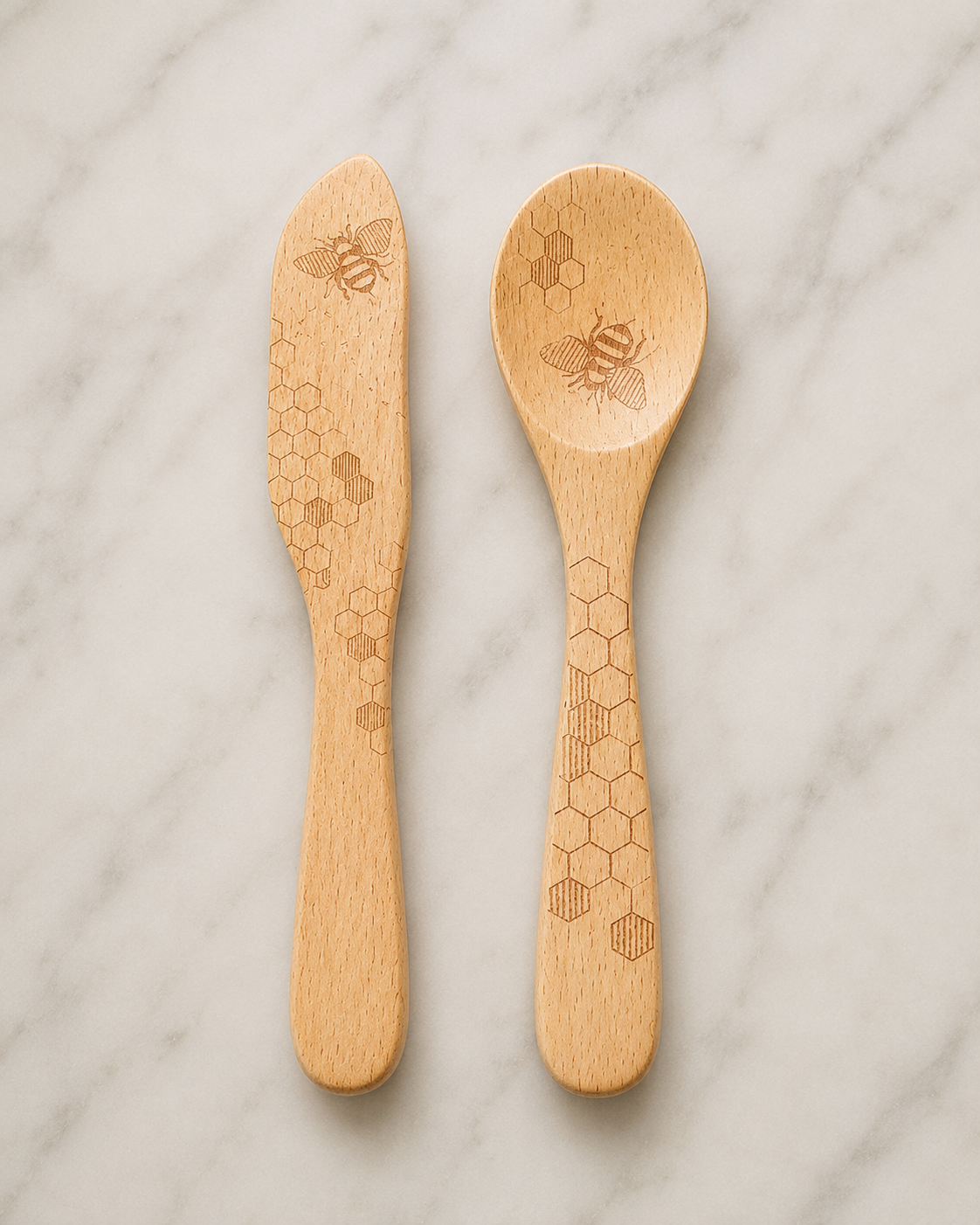 "Talisman Designs natural beechwood jam spreader and spoon set with laser-etched honey bee and honeycomb design, displayed on white marble"