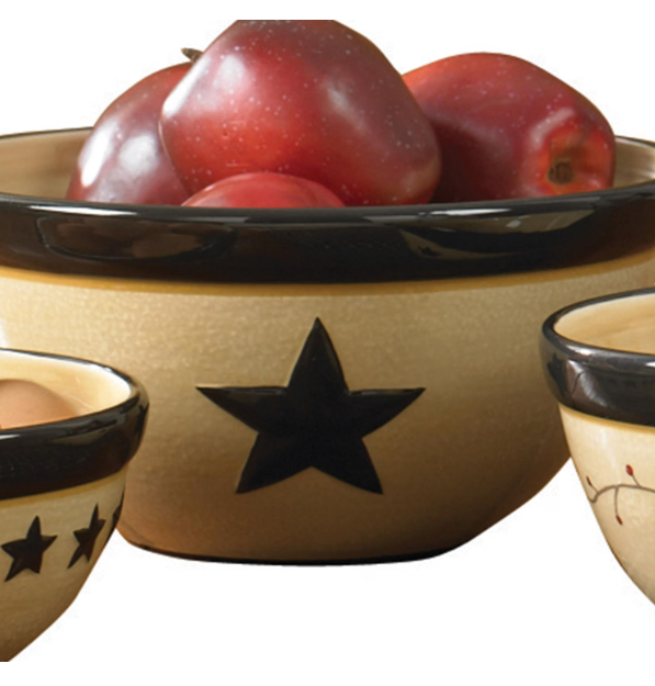 "Close-up of Park Designs Star Vine large dolomite mixing bowl with embossed star detail, filled with red apples"