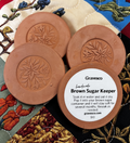 "Back of Gravesco handmade Brown Sugar Keeper showing product label with instructions — soak in water, place in sugar container to keep brown sugar soft for months"