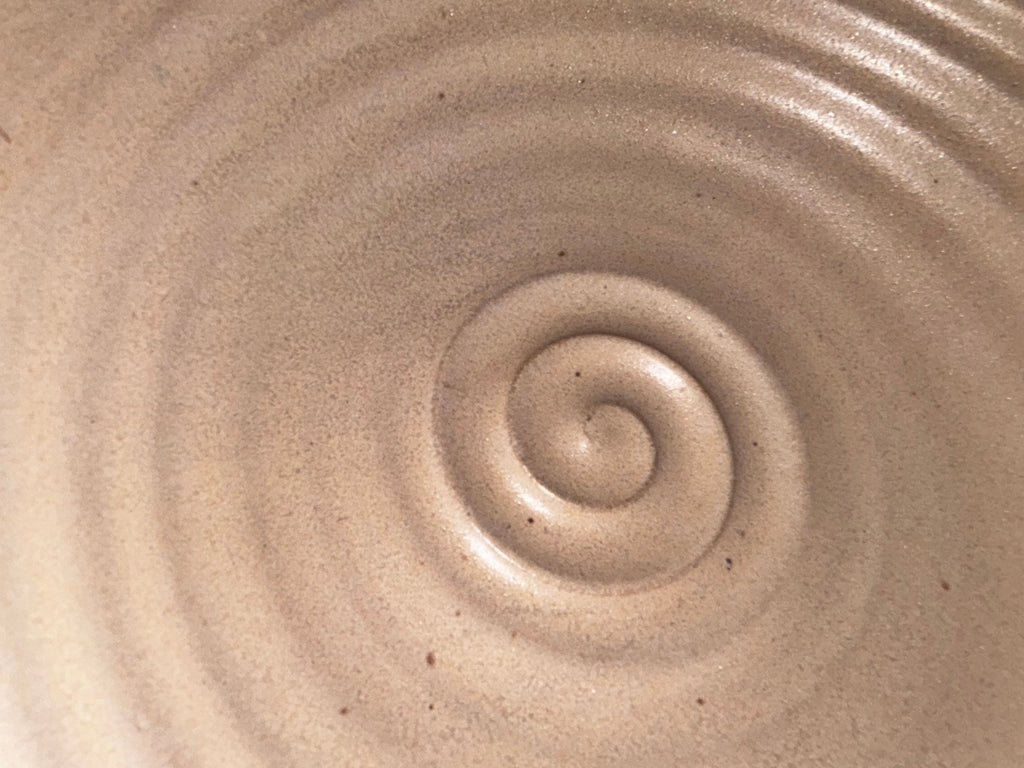 close of of center swirl in bottom of the mixing bowl cream in color