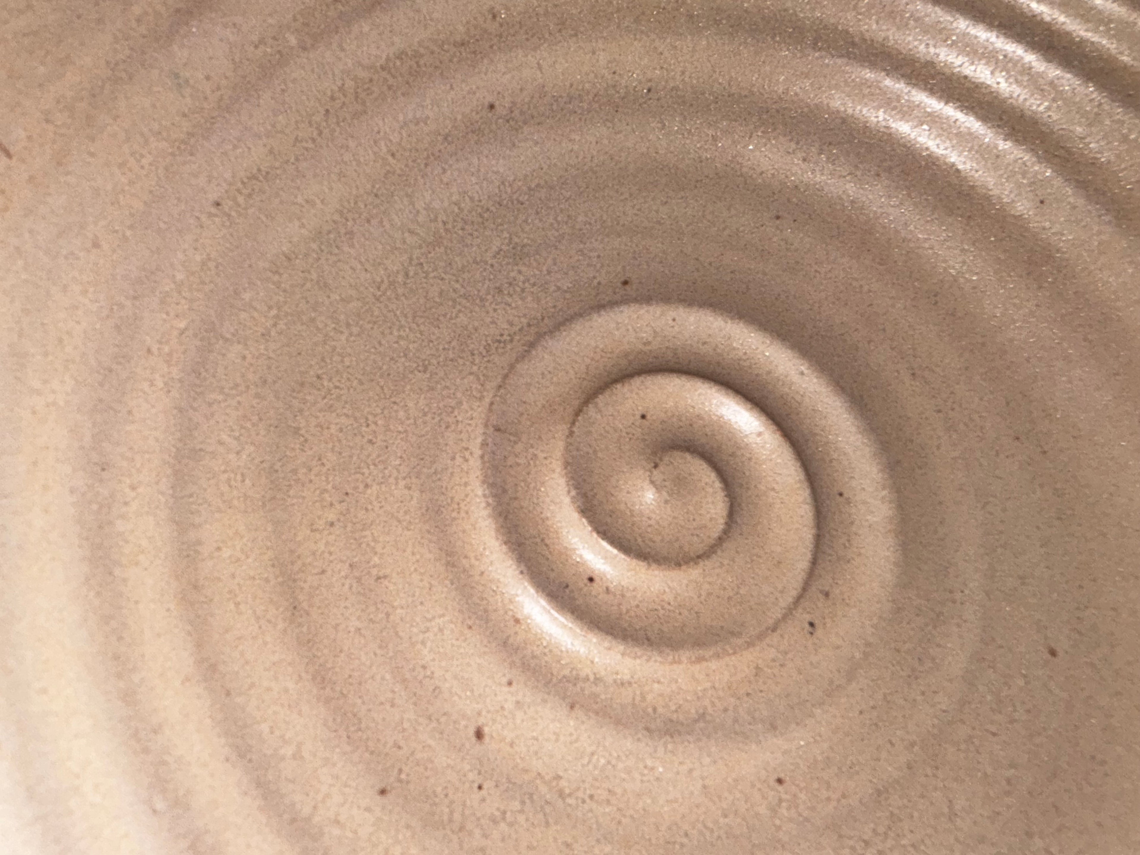 close of of center swirl in bottom of the mixing bowl cream in color